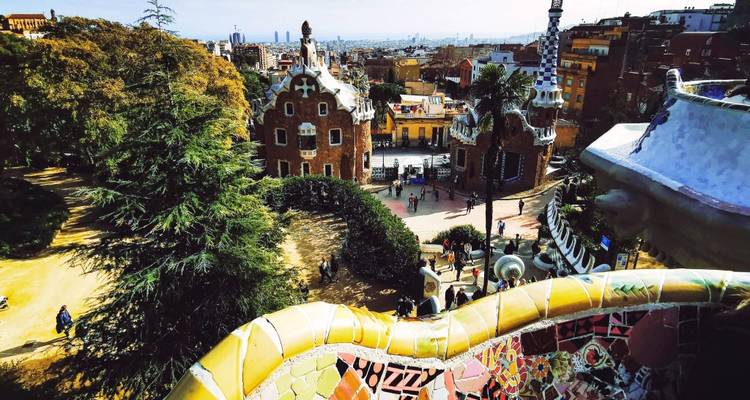 Colorful mosaic park with city view in Barcelona.