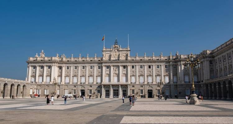 Wide courtyard in front of a grand palace.
