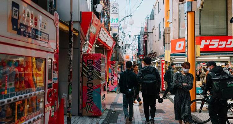 Street scene in a Japanese city with pedestrians.