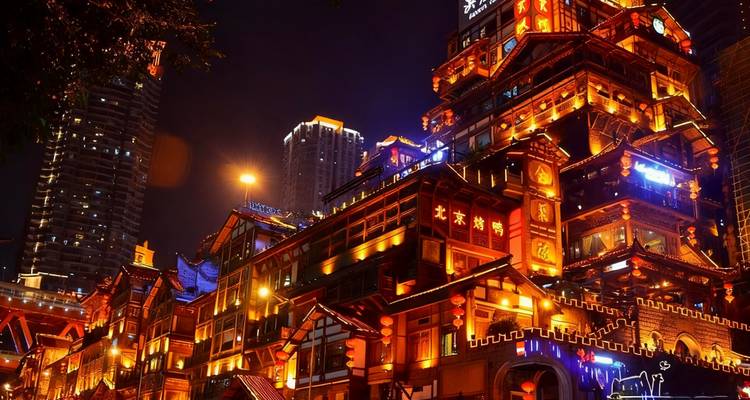 Vibrant night scene of a lit-up traditional building.