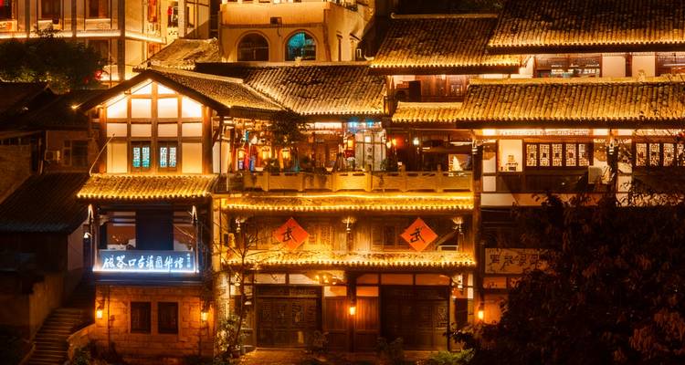 Traditional building lit up at night.