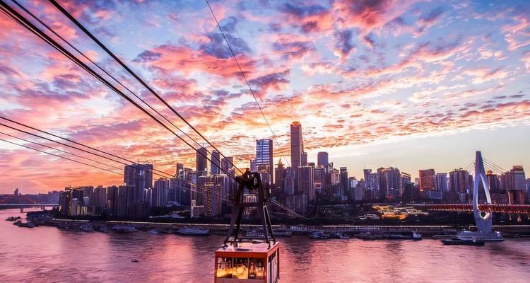 Cable car with cityscape of Chongqing at sunset.