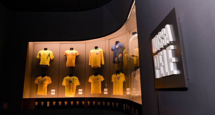 Museum exhibit showcasing Brazilian national team jerseys.