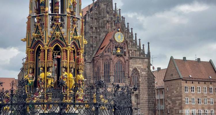 Gothic church with elaborate details and a golden structure.