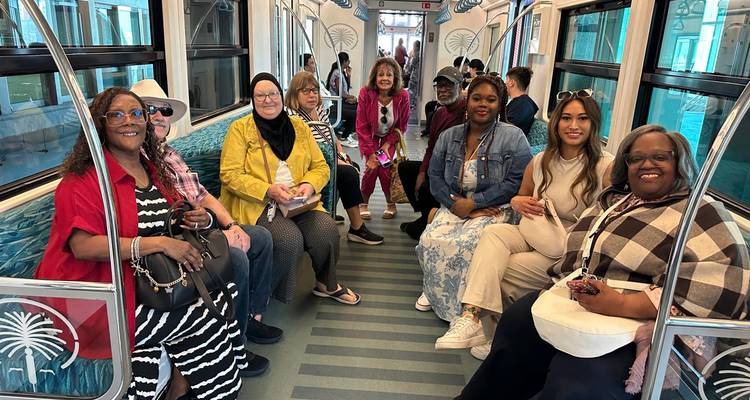 Group of people sitting in a public transport vehicle.