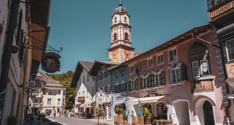 Street view of a charming European town with decorative buildings.
