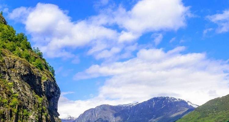 Scenic view of mountains with a bright blue sky.