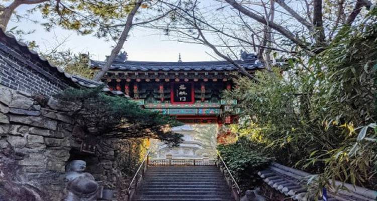 Traditional temple gate with surrounding greenery.