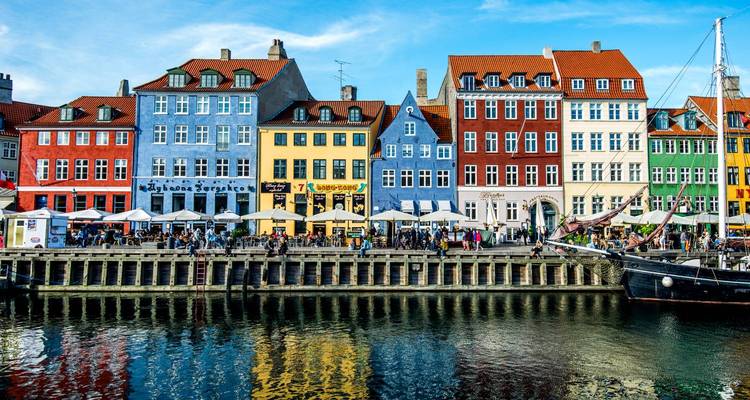 Colorful buildings and lively harbor in Copenhagen.