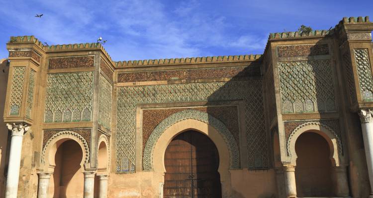 Bab Mansour gate in Meknes with intricate tile work.