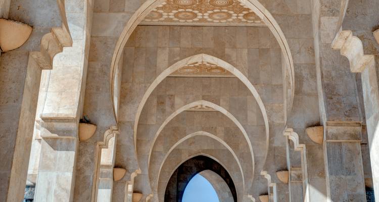 Intricate arches within a historical architectural setting.