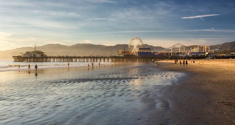 Santa Monica Pier and beach at sunset.