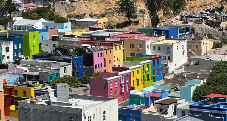 Colorful houses packed closely together on a hillside.