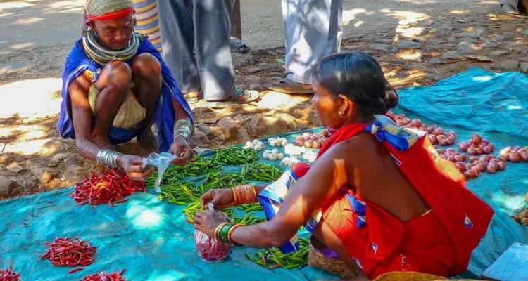 Local market scene with people trading produce.