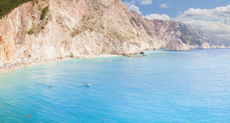 Cliffside beach with crystal clear water.