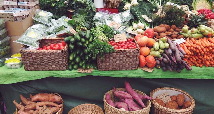 Market stall with fresh vegetables and produce.