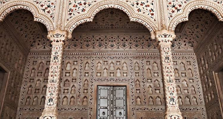 Detailed interior with ornate carvings and arches.