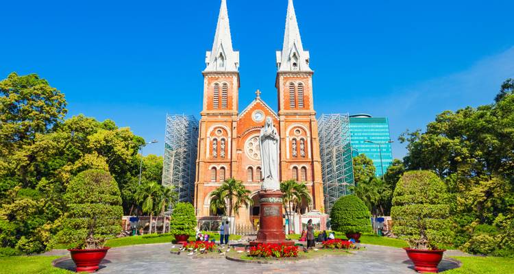 Notre-Dame Cathedral Basilica of Saigon with surrounding gardens.