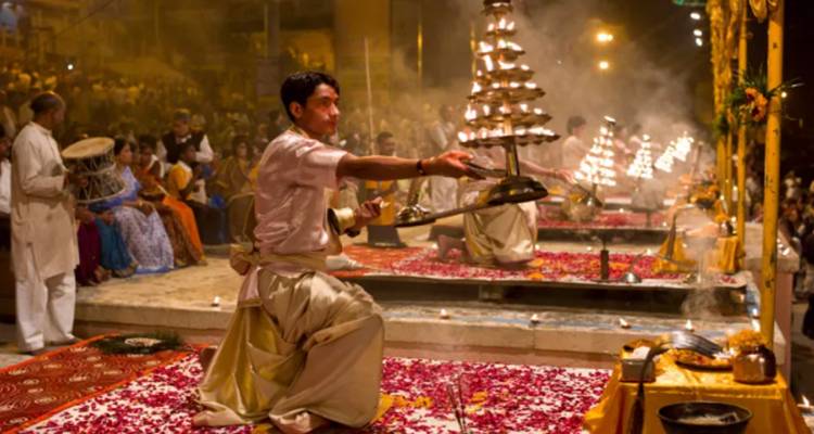 A traditional religious ceremony with a man performing rituals.