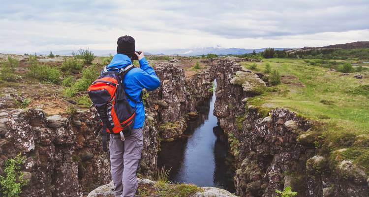 Photographer capturing a canyon in Iceland.