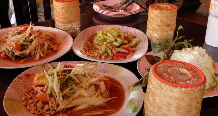 Traditional Thai dishes served on a table.