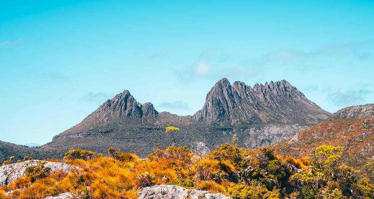 Mountain peaks under a clear blue sky.