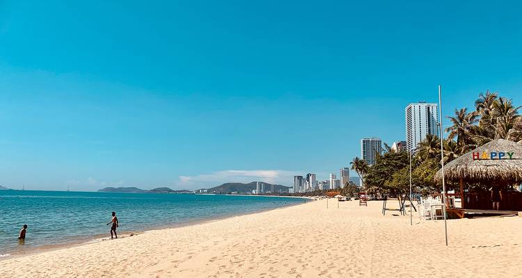 Sandy beach with city in the background, Nha Trang.