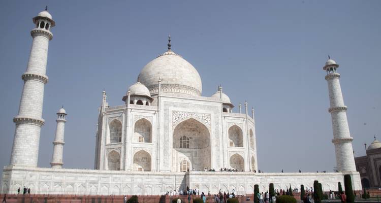 Taj Mahal with visitors on a clear day.
