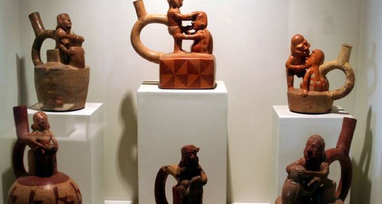 Collection of ancient pottery and artifacts on display.