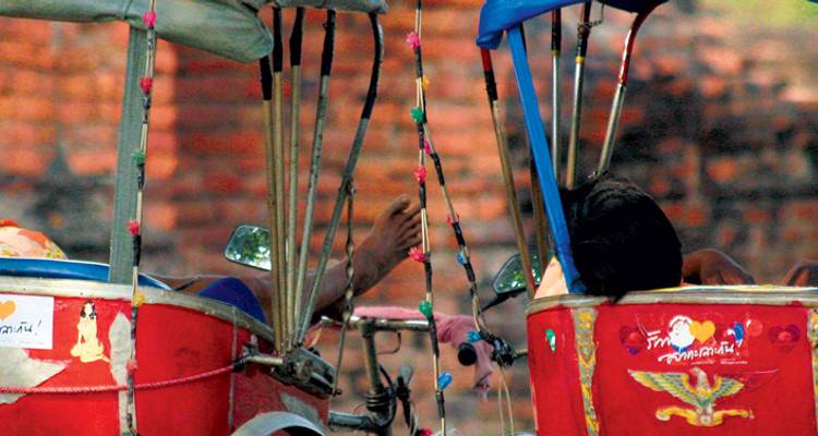 Blurred image of red tuk-tuks