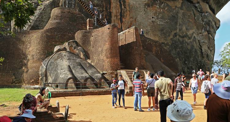 People visiting the entrance of the Sigiriya rock fortress.