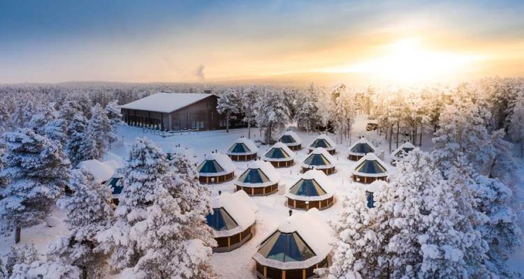 Panoramic view of snow-covered resort at sunset