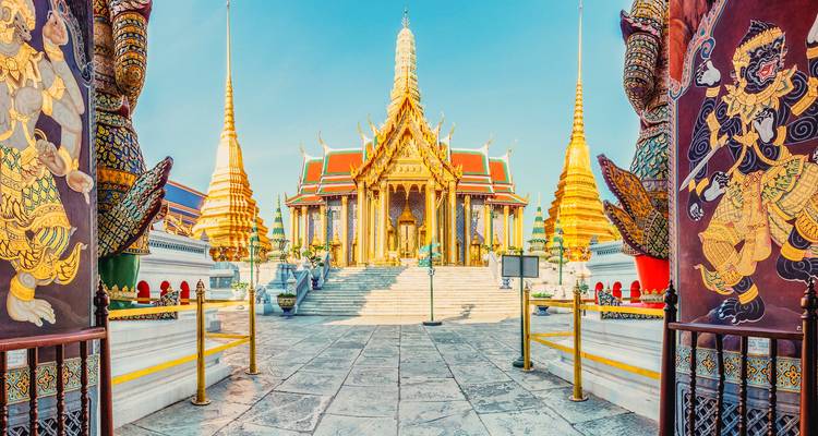 A stunning view of the Wat Phra Kaew temple with elaborate architecture and golden spires.