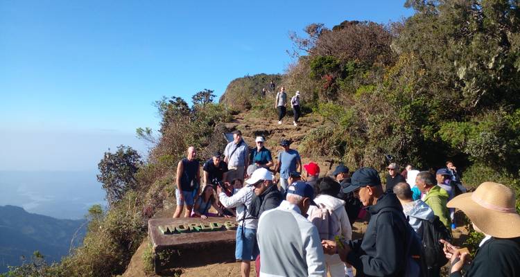 Visitors taking photos at a scenic viewpoint