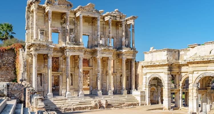 The ruins of an ancient library with detailed stone architecture.