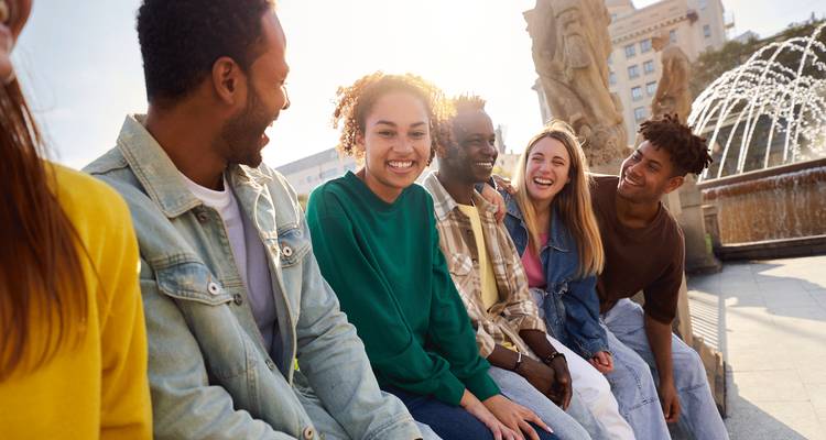 Group of friends enjoying their time near a fountain.