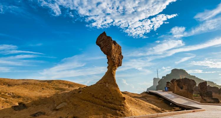 A unique rock formation with a clear blue sky.