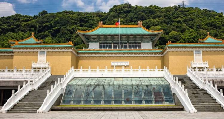 A historic building against a hill.