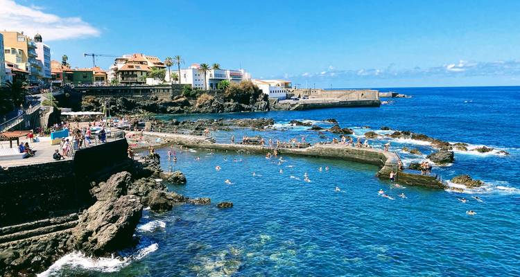 A popular coastal area with natural pools and rocky landscape.