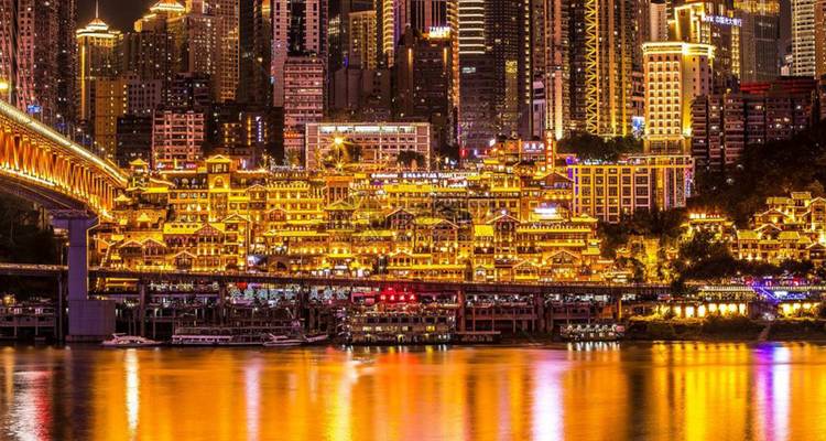 City lights reflecting on a river at night.