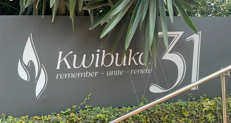 Sign saying 'Kwibuka 31' with slogan below.