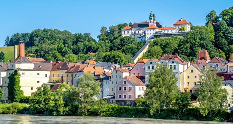 Colorful hillside town with historic buildings.