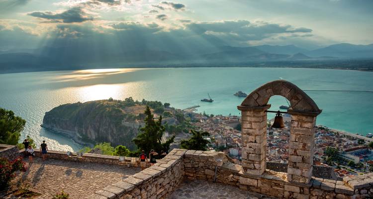 Scenic view from a historic castle over a coastal town.