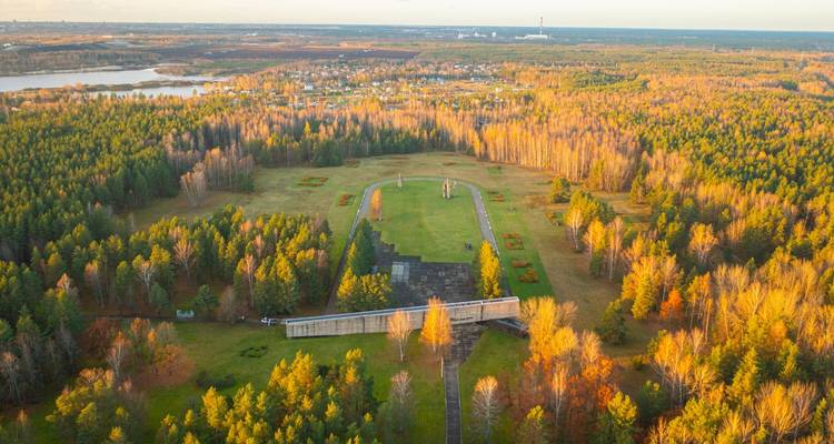 Large park area viewed from above, surrounded by trees.