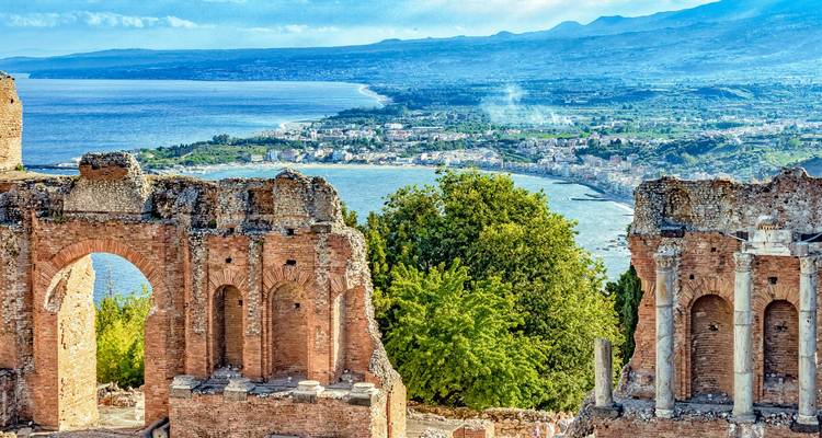 Ancient ruins overlooking a coastal view.