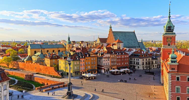 Old Town Market Place in Warsaw, Poland with historic buildings and column.