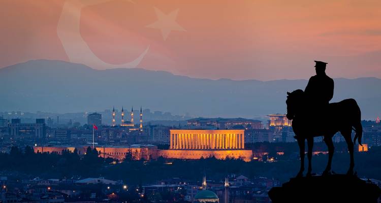 Ankara with a silhouette of a statue and the Anıtkabir in the background.