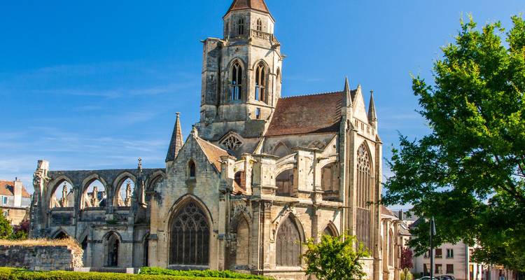 Ruins of a historic church with blue sky in the background.
