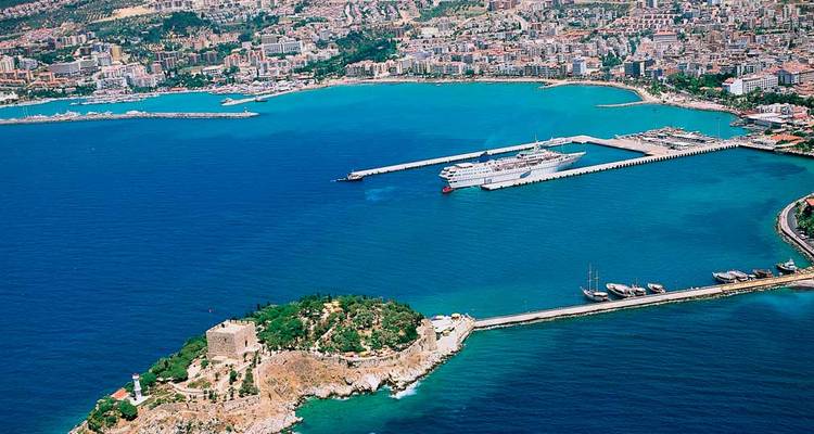 Kusadasi coastline and marina with beaches and blue waters.