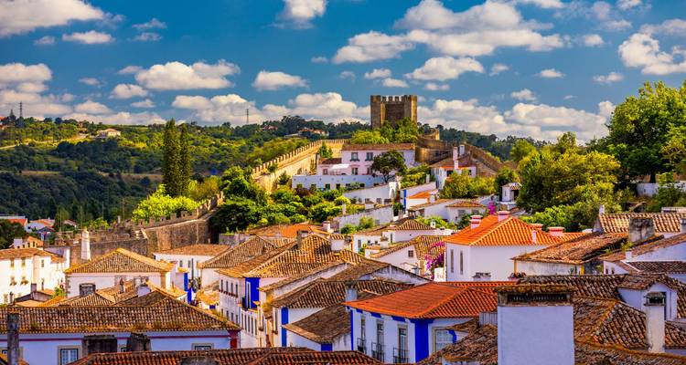 Historical town of Óbidos with a castle and medieval structures.